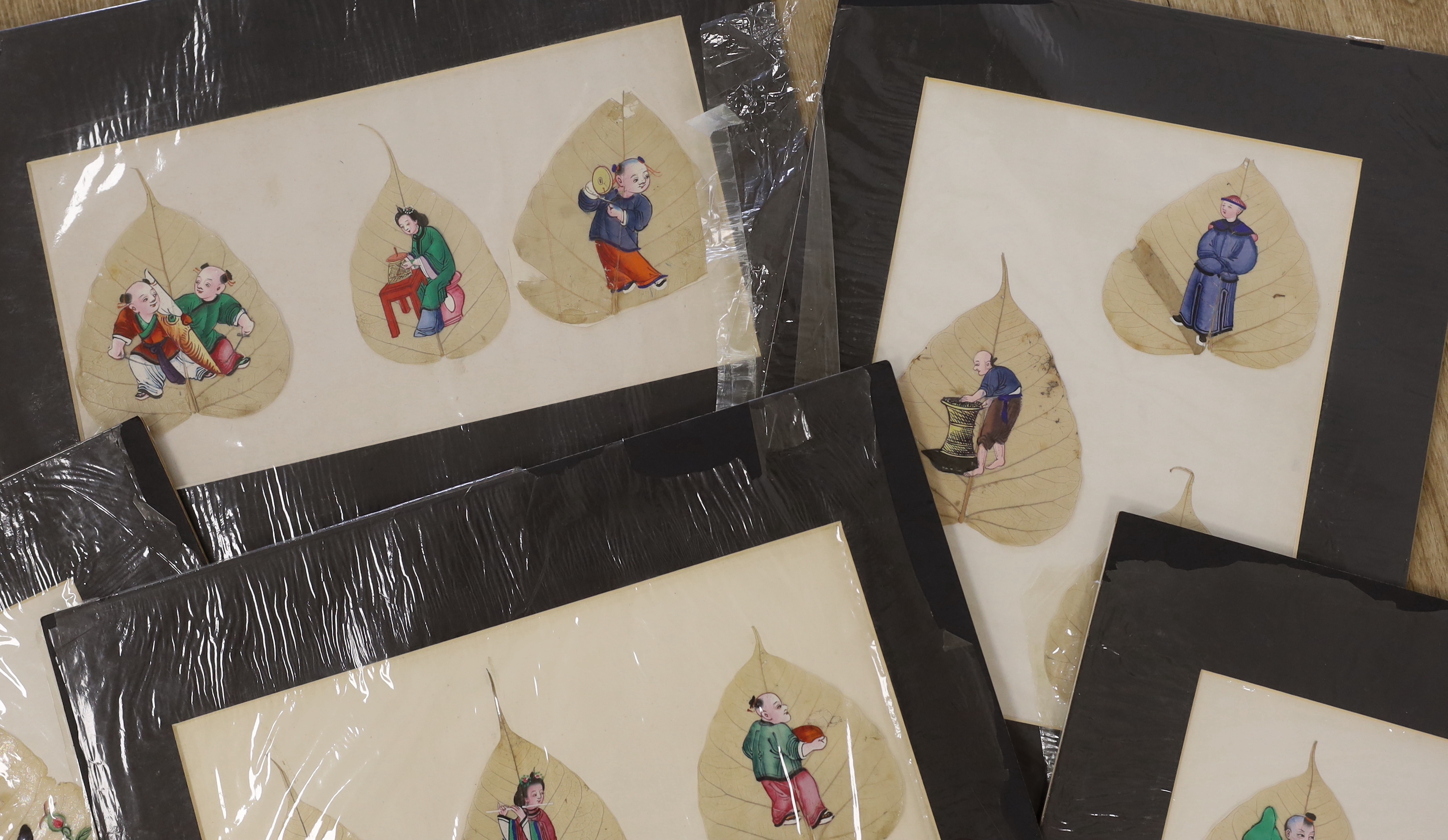19th century Chinese School, twenty gouaches on mulberry leaves, Studies of figures, birds and flowers, largest 24 x 14cm, unframed